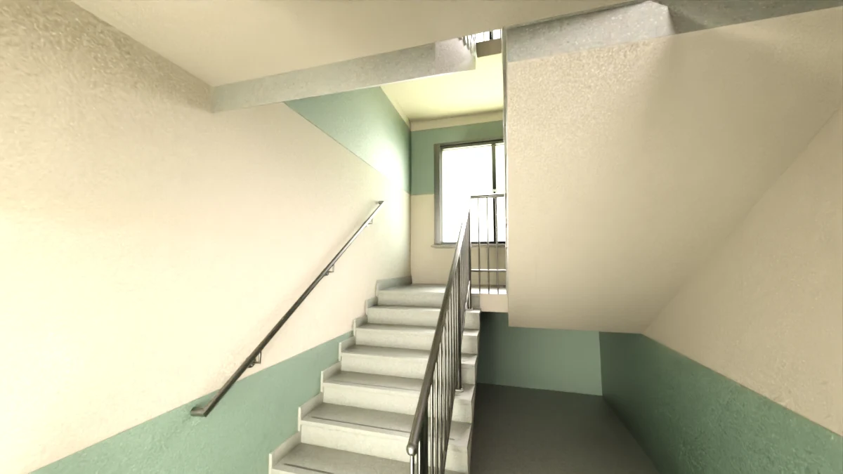 Apartment stairwell with green walls and metal railings